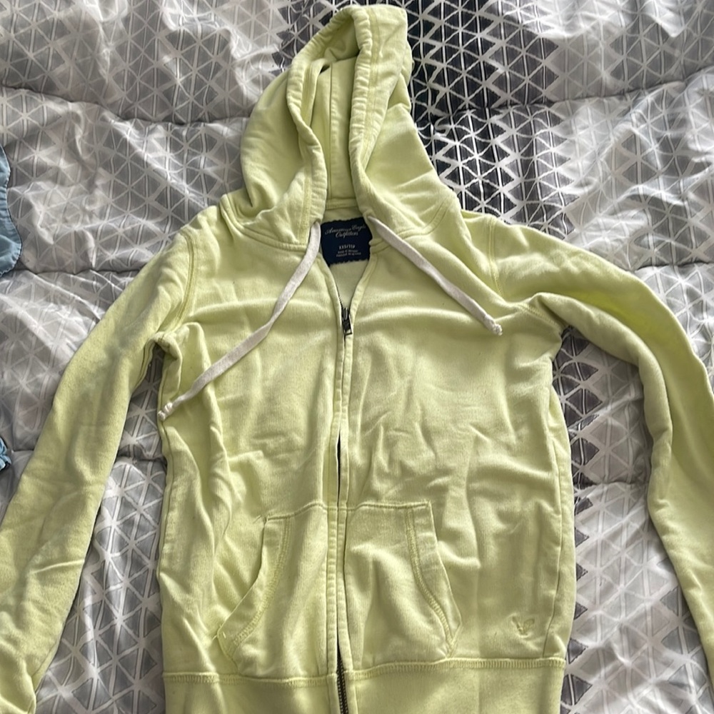 cute neon yellow zip up. worn but still in great condition.